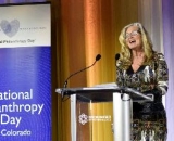 Sue Zoby speaking in front of a podium